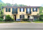 Semi-detached villa with land and warehouses.