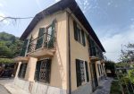 Semi-detached villa with land and warehouses.