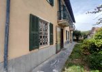 Semi-detached villa with land and warehouses.