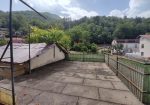 Semi-detached villa with land and warehouses.