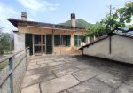Semi-detached villa with land and warehouses.