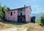 Farmhouse with land and private water source.