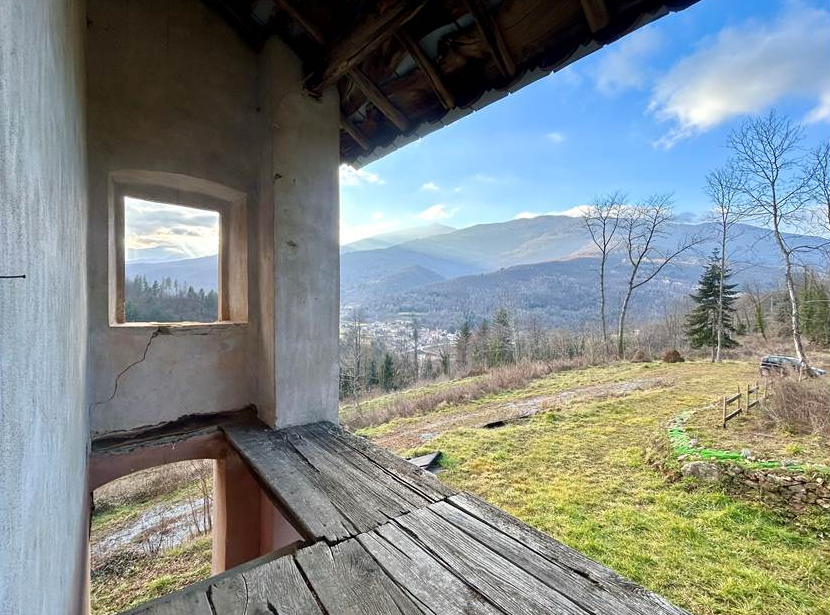 Farmhouse with land and private water source.