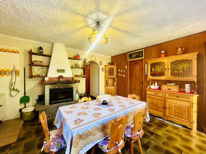 Detached villa with surrounding land.