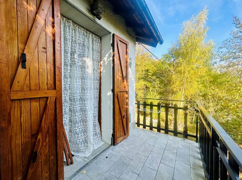 Detached villa with surrounding land.