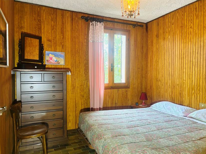 Detached villa with surrounding land.