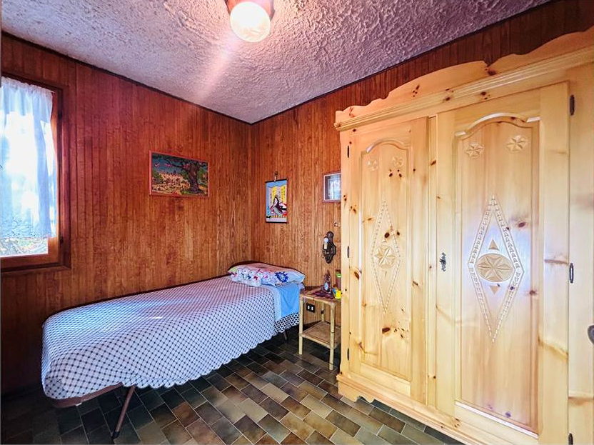 Detached villa with surrounding land.